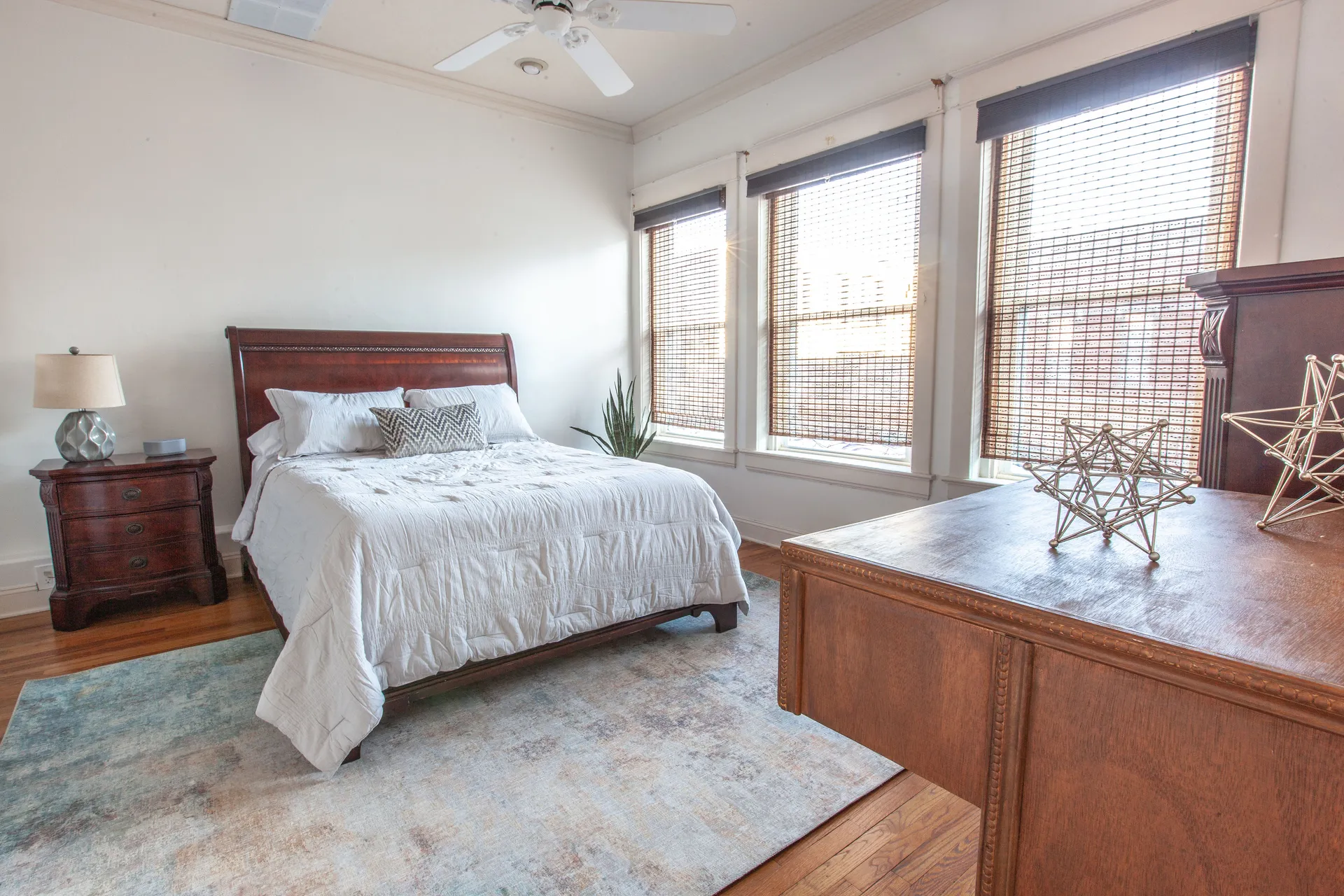 Loft B master bedroom with queen bed and natural light at Three Trails Lofts